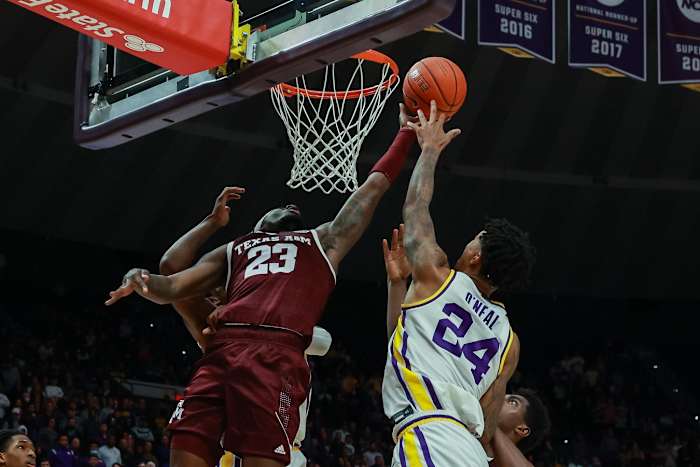 Texas A&M Aggies guard Tyrece Radford (23) goes for a rebound against LSU Tigers forward Shareef O'Neal (24) during the second half at the Pete Maravich Assembly Center.